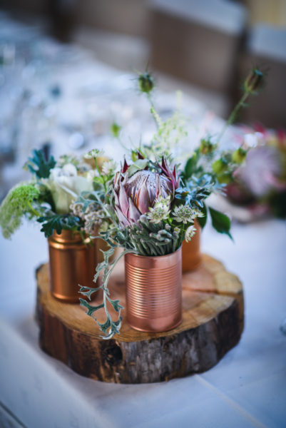 Table Centrepiece with Protea in copper tins