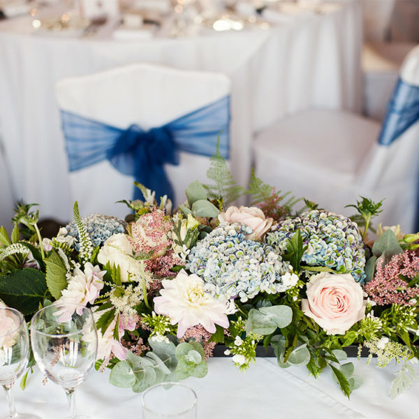 Top table flowers for a navy themed wedding